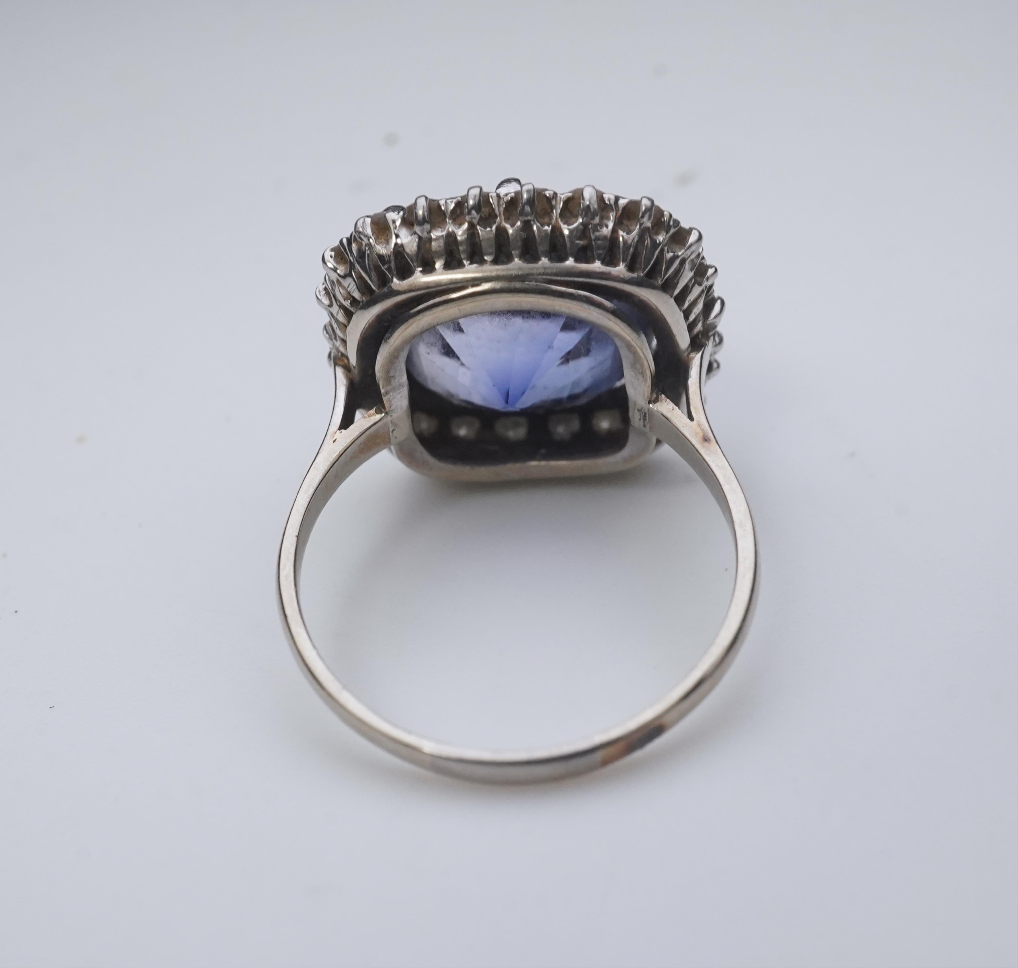 A synthetic sapphire and diamond cluster ring, early 20th century